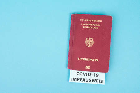 German passport with covid-19 certificate, traveling due to pandemic, new normal, regulationsの写真素材