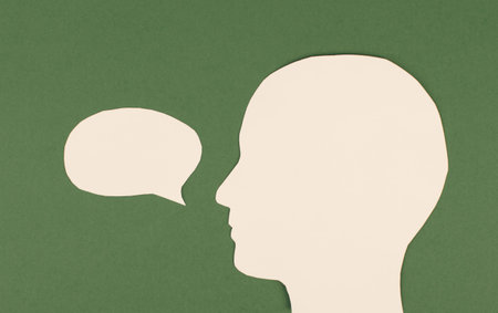 Silhouette of a face, speech bubble in white color, copy space for text, communication, having an...
