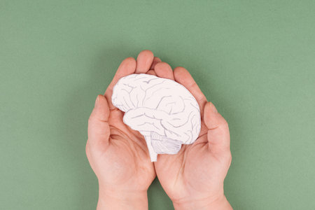 Holding a brain in the hands, Parkinson's disease, Alzheimer's awardness, mental disorder dementia,...