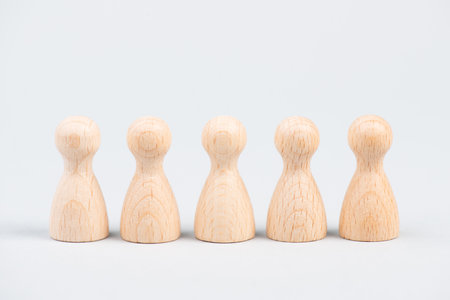 Group of people, equal men, social distancing, community of humans, teamwork in business, crowd, wooden figuresの写真素材