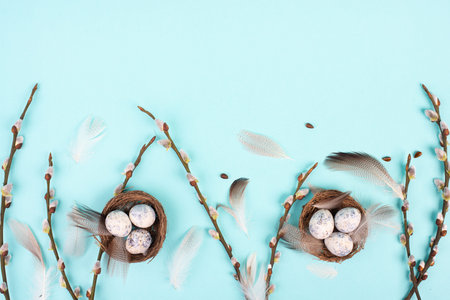 Easter holiday background, nest with small eggs, branches of pussy willow, greeting card, spring...