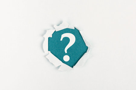 Question mark on paper background, search for answers, education concept, faq in businessの写真素材
