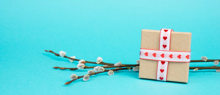 Little gift box with heart ribbon, copy space, background and greeting card for mother's day,...