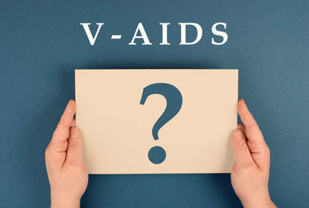 The word v-aids is standing on a paper, new autoimmune disease caused by covid-19 vaccination, immune system damage, health issueの写真素材