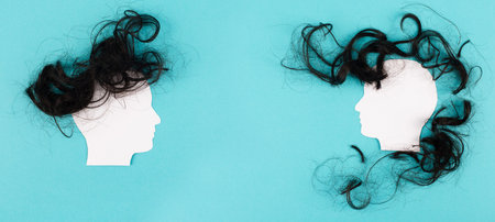 Silhouette of two faces with hair looking at each other, communication, having an opinion and...