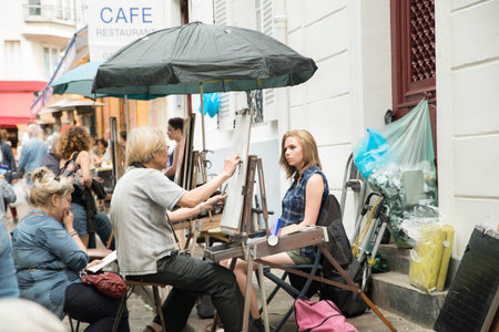 Montmartre Paris, painter at the place du tertre, tourism attraction in France, artists drawing portraits, Paris at the Montmartre on the 04.08.2017のeditorial素材