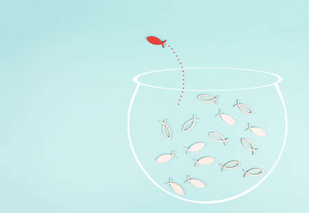 One fish is the leader of the group, leadership and teamwork concept, be a winner, success and start up in business, follow a new idea, fishes in an aquarium jump to freedomの写真素材
