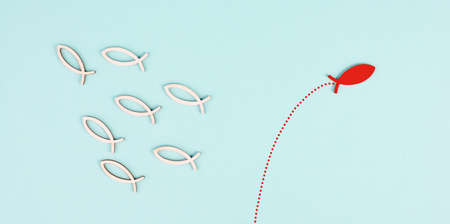 One fish is the leader of the group, leadership and teamwork concept, be a winner, success and start up in business, follow a new idea, jump to freedomの写真素材