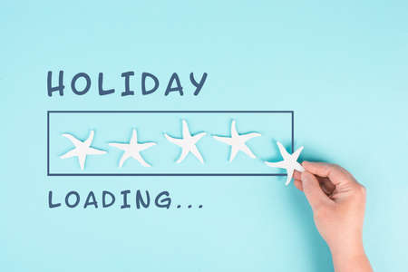 Progress bar with sea stars, holiday loading is standing on the paper, planning a trip for the weekend, vacation and travel conceptの写真素材