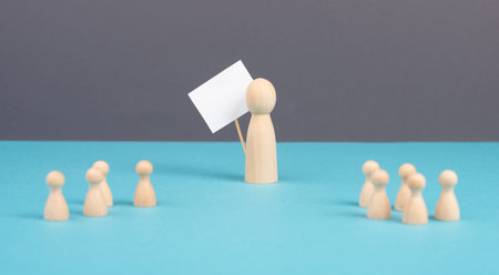 Group of people, teacher with children, manager recruiting workers, standing out from the crowd, teamwork and leadership, man holds empty signの写真素材