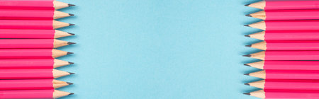 Pink pencils building the frame, empty copy space in the middler, education and office concept, back to school, art and craftsの写真素材