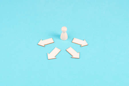 Arrows on a road showing in different directions, person has to make a decision, choosing an option, new way to go, analyzing opportunitiesの写真素材