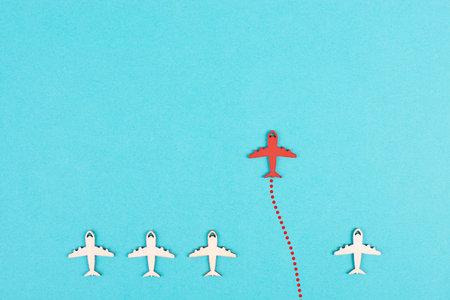 Red airplane is flying to his goal, leadership, courage and winner concept, standing out from the...