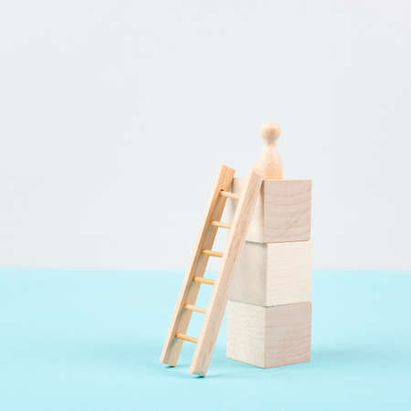 Man was climbing up the ladder, having a goal, brainstorming for ideas, success strategy, taking a challenge, business conceptの写真素材
