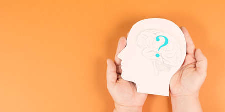 Head with a brain and question mark, education and business concept, searching for answers, thoughts for solving a problem, one has doubtsの写真素材