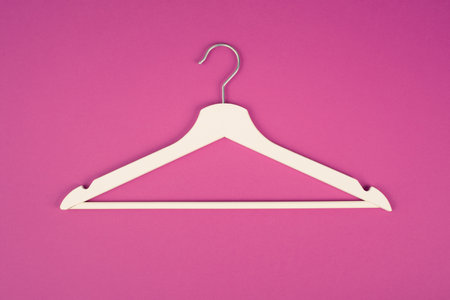 White hanger on a pink background, fashion store, minimalism clothes, discount promotionの写真素材