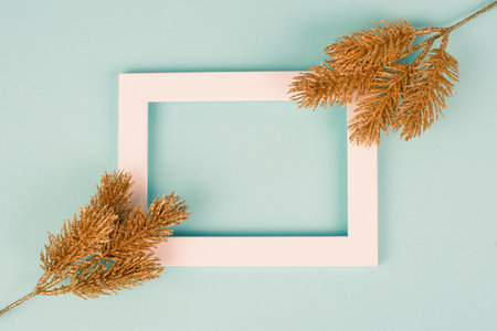 Christmas holiday background, frame with golden fir branches, winter season greeting cardの写真素材