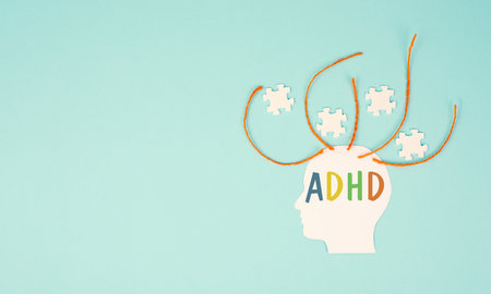 ADHD, attention deficit hyperactivity disorder, mental health, head with puzzle piecesの写真素材