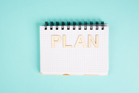 Plan is standing in a notebook, planning new goals, to do list, colorful pencils, new year resolutionsの写真素材