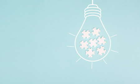 Light bulb with jigsaw or puzzle pieces, brainstorming for ideas, finding solution, solving a...
