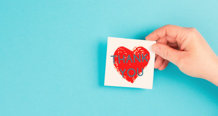 Thank you is standing on the heart, being thankful, support, help and charity concept, positive...