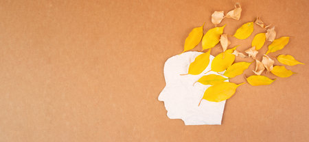 Dementia diagnosis, Parkinson's disease, Alzheimer's awareness day, memory loss disorder, brain with autumn foliage, aging mindの写真素材