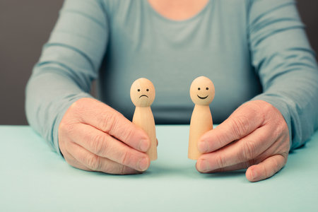 Mind with a sad and a happy face, mental health concept, positive and negative thinking, self esteem and perception, emotionの写真素材