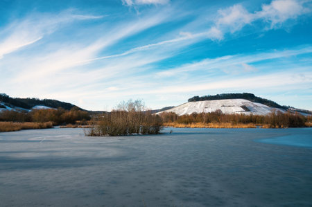 Biodiversity Haff Reimech, wetland and nature reserve in Luxembourg, pond surrounded by reed and...
