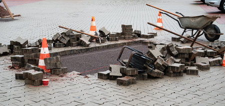 Repairing the sidewalk or parking lot, emergency service for broken pavement, construction siteの写真素材