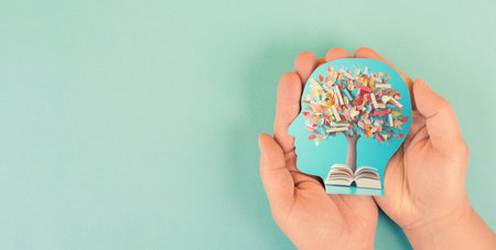 Education, knowledge and skill learning with literature, world book day, books growing on a tree, reading a storyの写真素材