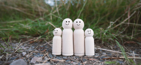 Happy smiling parents with two children, relationship in family, care and security concept, charity, lifestyleの写真素材