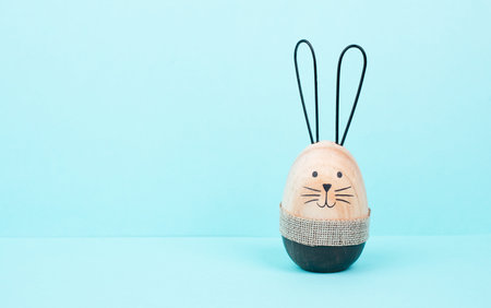 Cute easter bunny or rabbit with a smiling egg face, spring holiday, greeting cardの写真素材