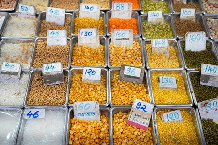Red and yellow lentils for sale on a spice market in Mumbai, India, fresh ingredients for cooking Indian foodの写真素材