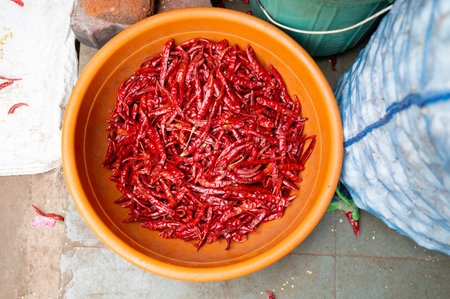 Red chilli pepper spices for sale on a spice market in Mumbai, India, fresh ingredients for cooking...