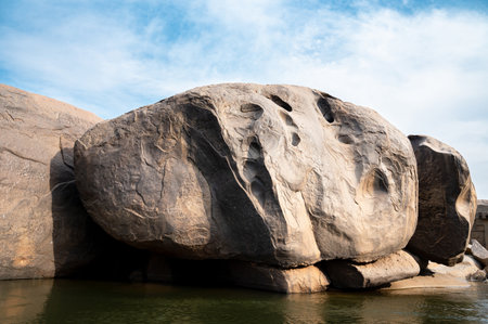 Boulders of Hampi in the Tungabhadra river, rocky terrain landscape, South India, Karnataka, panoramic viewの写真素材