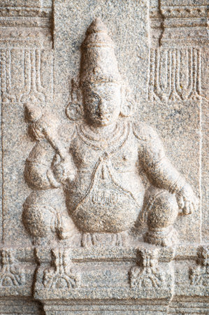 Ancient Jaya statue of dwarpal of Vishnu, Virupaksha temple of Hampi, carved into boulder, Hinduism religion, god, Ganesh at ruin of Vijayanagara Empireの写真素材