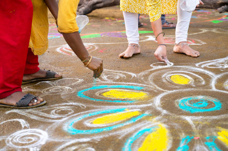 Kolam, colorful sand painting with rice powder drawn by women and girls at the evening of Holi festival in India, Indian religion and culture, Hinduism celebrationの写真素材