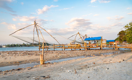 Chinese fishing nets on the shore of Kochi, Kerala in India, Cheenavala or tangkul, traditional stationary lift netの写真素材