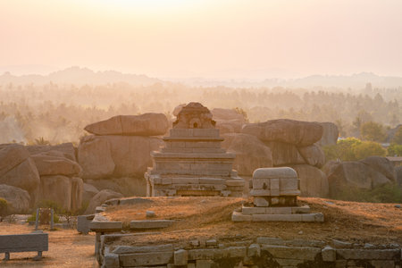 Ruin temple, boulder landscape, Hampi at Hemakuta Hill, sunset, South India, historic monument, ancient Vijayanagara Empire, Hindu culture and religionの写真素材