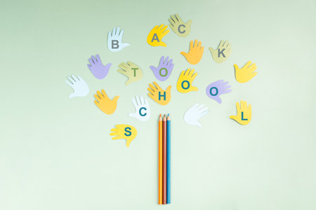 Back to school, colorful pencils and children's hands building a tree, education and skill learning, growth of knowledgeの写真素材
