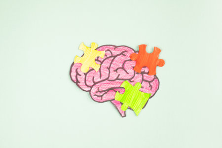 ADHD, attention deficit hyperactivity disorder, mental health, brain with cognitive difficulty, colorful puzzle piecesの写真素材