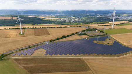 Solar panel power station, wind turbine, renewable efficient sustainable energy, electricity and environment conversation, agriculture field, windmillsの写真素材