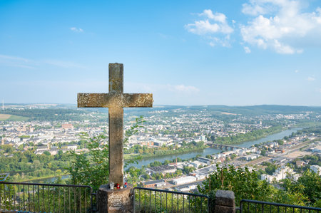 Religious cross, Metzgerskreuz at Pulsberg, roman city of Trier, Moselle Valley, cityscape and Mosel river, Germanyの写真素材