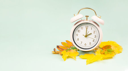 Winter time changeover, end of daylight saving time in autumn, alarm clock fall back switch,...