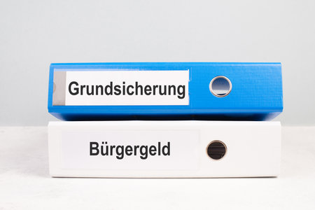 Citizen money, BÃ¼rgergeld in german language, becomes basic guarantee money security, new financial help reform for unemployment in Germany, social issueの写真素材