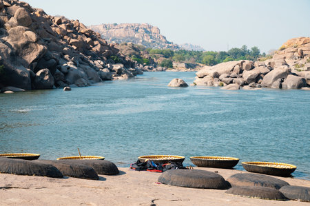 Hampi, coracle boats at Tungabhadra River,India, traditional round fishing basket boat made from cane, leather and bitumenの写真素材