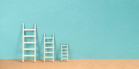 Ladder of success and opportunity, targeting a goal, business challenge, achievement, vision and ambition, planning future progress and developmentの写真素材