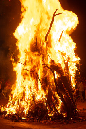 Holika Dahan, ritual bonfire, evening before the holi festival in India, symbol for burning the...
