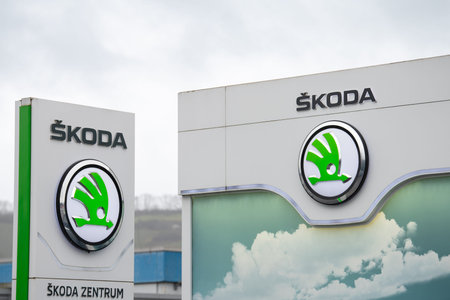 Skoda brand logo, Czech car automobile manufacturer, profit collapse of industry in Germany, Trier,...