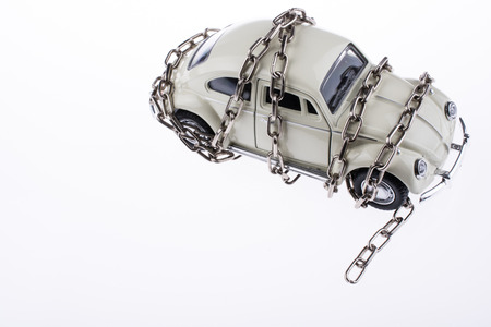 Chained white car on white backgroundの写真素材
